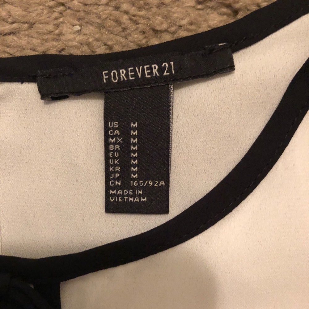 White blouse with black tie in front - Picture 2 of 4